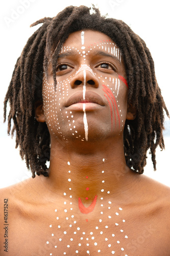 Plakat A man with dreadlocks and face painting