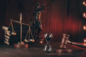 Judge's gavel, scales, lady of justice and hourglass. Law and justice concept.