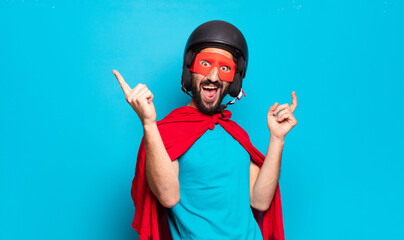 Wall Mural - young bearded man. crazy and humorous super hero with helmet and mask