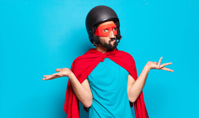 Wall Mural - young bearded man. crazy and humorous super hero with helmet and mask