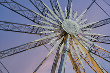 Close Up Of Ferris Wheel At Sunset Time.