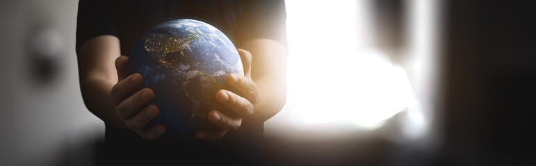 Wall Mural - panoramic - man with the world with his hands - elements of this image furnished by nasa
