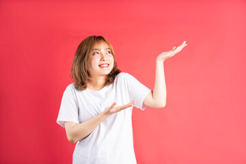 Young asian girl with cheerful gestures and expressions on background