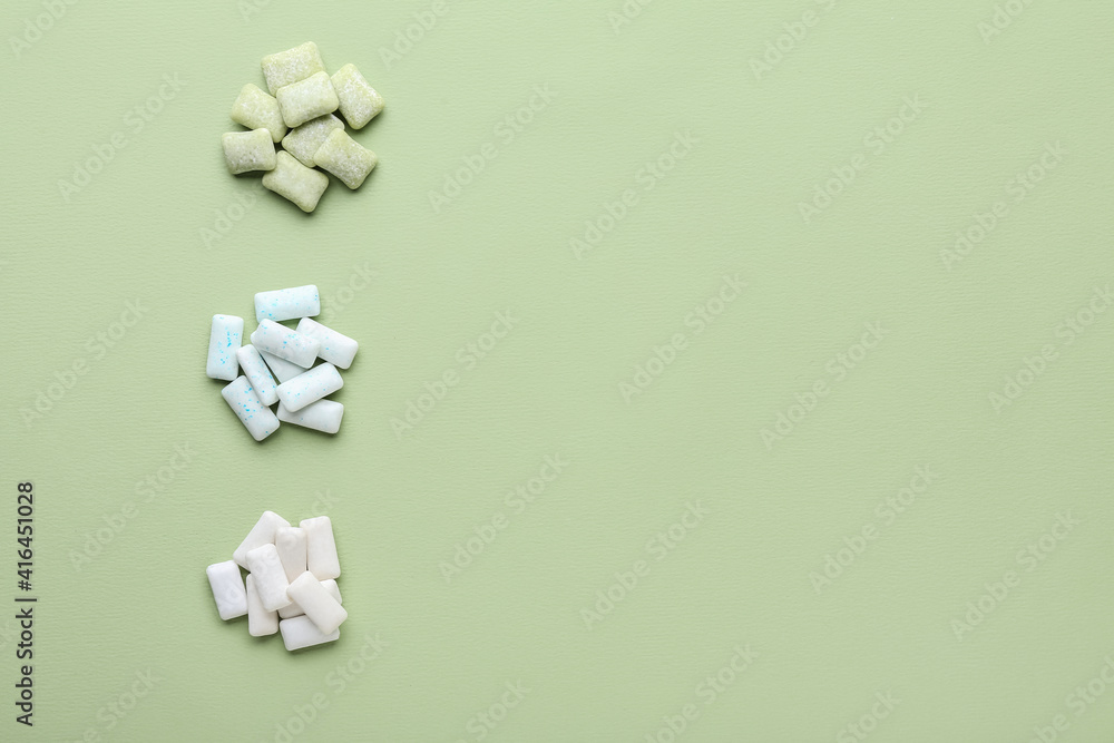 Chewing gums on color background