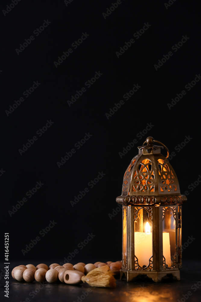 Muslim lamp and tasbih on dark background