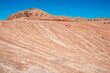 Fire Wave at Valley of Fire is a banded red and white sandstone formation a short hike away from parking lot 3.