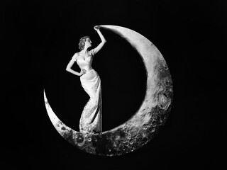 Young woman in evening elegant dress. Fashion Night dress. Beautiful young women posing on crescent moon on black background. Girls dream.