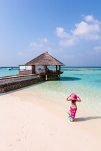 Woman With Sarong In A Luxury Resort, Maldives