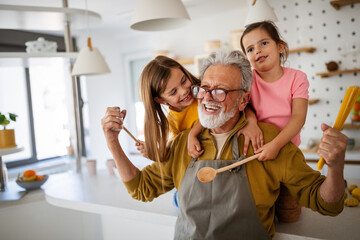happy grandparents having fun times with children at home