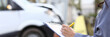 An agent fills out paperwork after car accident. Vehicle insurance concept