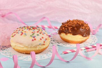 Wall Mural - Traditional German dessert similar to doughnut with no hole called 'Berliner Pfannkuchen' made from sweet yeast dough fried in fat glazed with white chocolate and sprinkles