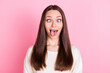 Photo of positive young lady squint eyes tongue out grimace isolated on pastel pink color background