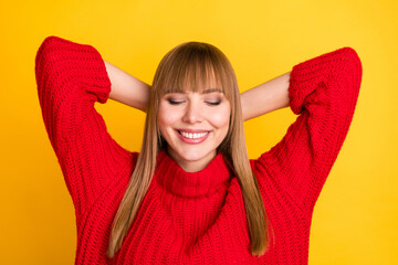 Poster - Photo of blond optimistic lady hands head sleep wear red sweater isolated on bright yellow color background