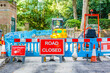 Street barricaded with ROAD CLOSED signs in Hampstead Heath, London