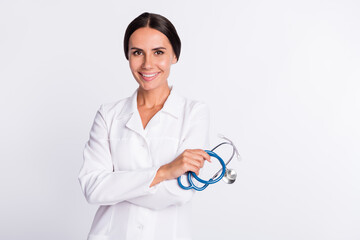 Poster - Photo of charming positive young woman therapist wear formal coat holding stethoscope empty space isolated white color background