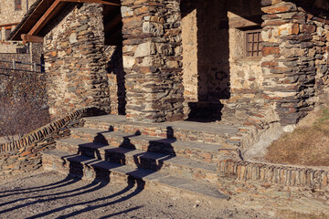 The deep shadows of three tourists on the steps of an ancient stone temple.  The concept of the lack of tourists in Europe, tourism decline concept.