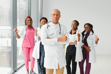 Wall Mural - group of young african medical workers on white background