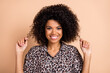 © deagreez - Photo portrait of curly woman touching hair wearing printed shirt smiling isolated pastel beige color background