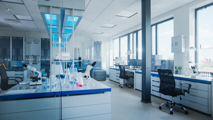 Wall Mural - modern medical research laboratory with computer, microscope, glassware with biochemicals on the des