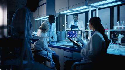Wall Mural - medical research laboratory meeting: diverse team of scientists use digital tablet computer, discuss