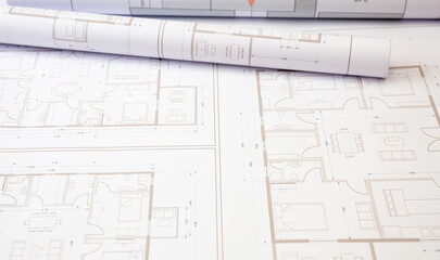 Construction concept. Residential building drawings on an office desk