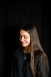 © Emanuele Capoferri - portrait of teenage girl with black background -smiling girl with long hair portrait-