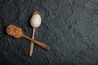 Cookie and raw egg on dark background