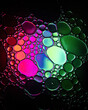 Oil drop bubbles on a water surface abstract with a green, blue and pink background