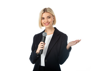 happy anchorwoman with microphone pointing with hand isolated on white