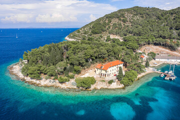 Wall Mural - Aerial drone shot of small peninsula on Vis Island in Adriatic sea in Croatia summer