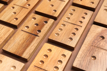 Sticker - Set of wooden domino tiles on brown background, closeup