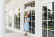 © ksyusha_yanovich - Attractive young girl on the background of the white house in a blue dress