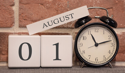 Wall Mural - Important date, August 1, summer season. Calendar made of wood on a background of a brick wall. Retro alarm clock as a time management concept.