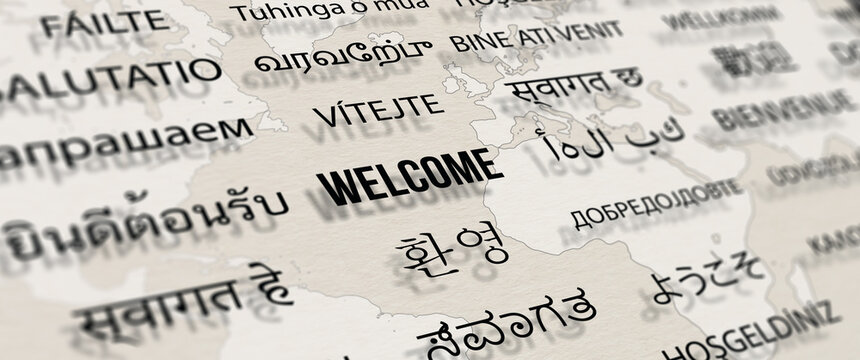 Wall Mural -  - Welcome in different language on paper with world map background. Depth of field image. Words cloud concept.