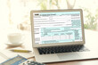 © utah51 - Tax concept, Online tax form filling on the laptop screen.