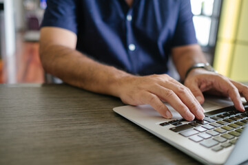 Wall Mural - men use laptops on the table in cafes, there is free space to fill the message for you.