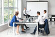 © Pixel-Shot - Businessman giving presentation during meeting in office
