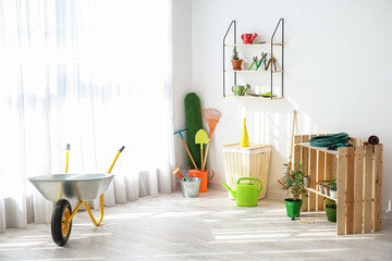 Poster - Set of gardening supplies and houseplants in barn