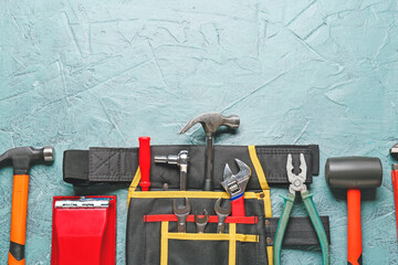 Set of construction tools on color background