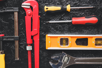 Set of construction tools on dark background