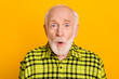 Photo of elderly man amazed shocked surprised fake novelty news rumor isolated over yellow color background