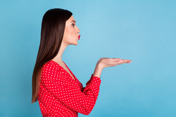 Poster - Profile side view portrait of attractive girl sending air kiss amour date isolated over vibrant blue color background