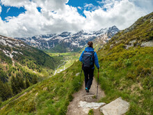 A Young Female Hiker Does Trail Hiking In The Mountains Of Gastein In Austria.