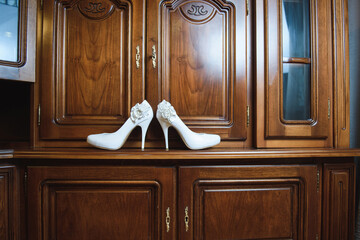 Wall Mural - wedding shoes on wooden wardrobe