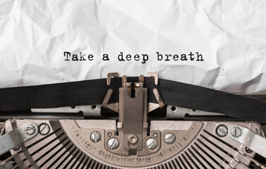 Wall Mural - text take a deep breath typed on retro typewriter