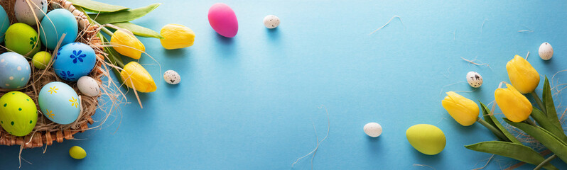 Easter Eggs And Flowers On A Blue Background