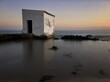 Fisherman´s hut at sunset in the beach