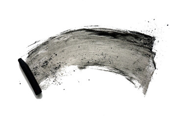 Black compressed charcoal sticks for drawing. Abstract black shapeless spot and charcoal sticks on a white background. Texture with chaotic smudges.