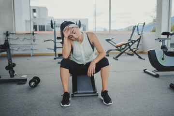 Wall Mural - tired young fitness woman