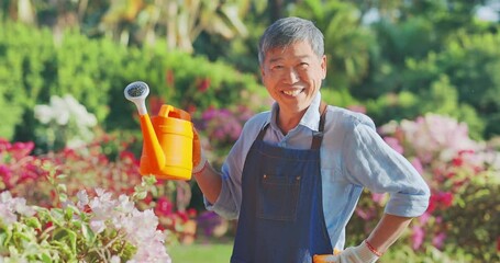 Sticker - senior man watering the garden